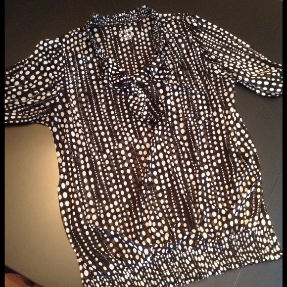 Sold. Short sleeved, sheer top very flattering!