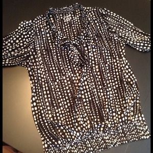 Sold. Short sleeved, sheer top very flattering!