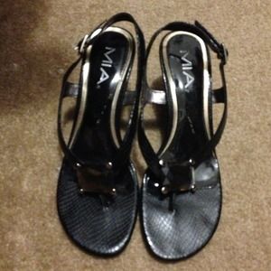 Mia Black Strappy heels with a rhinestone.