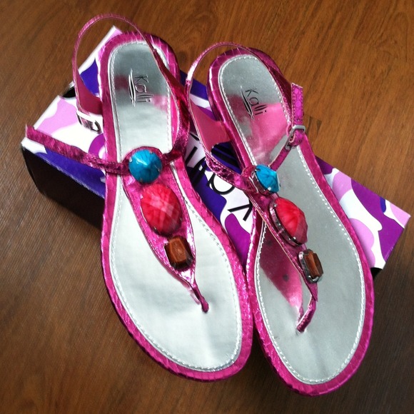 Hot pink sandals with colorful stones.