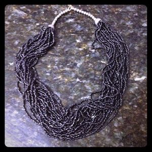 Multi-strand black beaded necklace