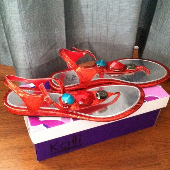 Reddish-orange flat sandals