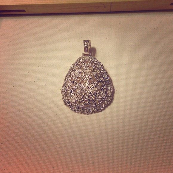 *HOLD*. Silver pendant.