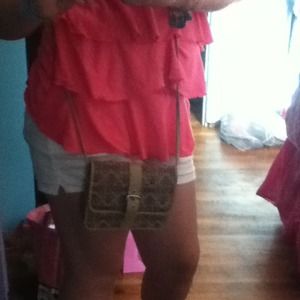 Light brown long strap handbag.