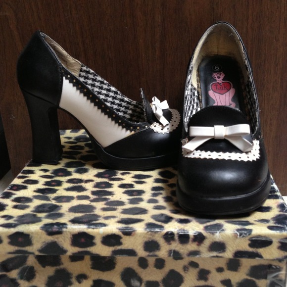 Black and white greaser pumps. Like 80's style.
