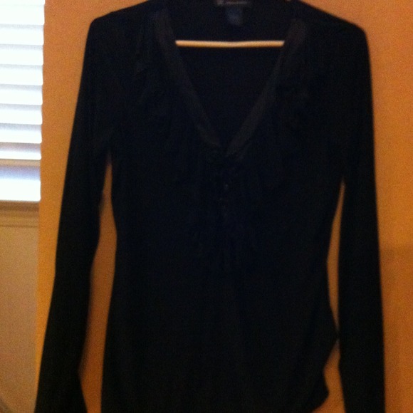 Black v neck top with leather tie.