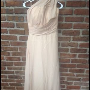 One shoulder A-line bridesmaid dress in champagne.