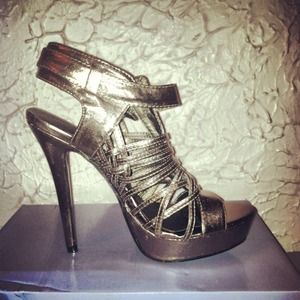 Dark silver five inch strappy heels. 👠