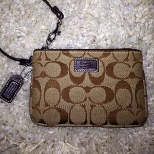 Authentic wrist wallet by Coach!