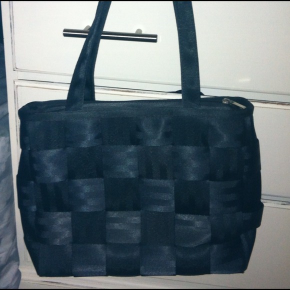 Classic black seatbelt purse.