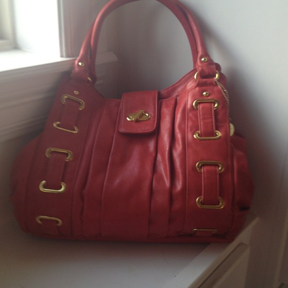 A beautiful Coral Colored Big Budda Handbag.