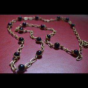 Black bead and gold chain necklace