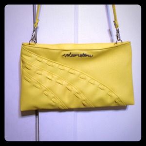 Yellow Volcom stone purse/clutch.