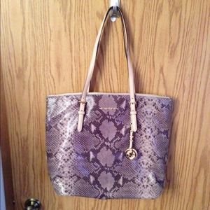 Michael Kors embossed tote bag.