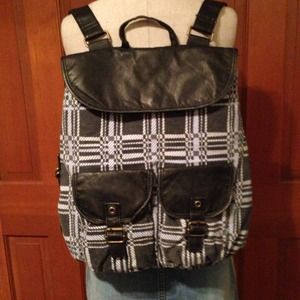 It's a backpack of course. Faux leather detail.