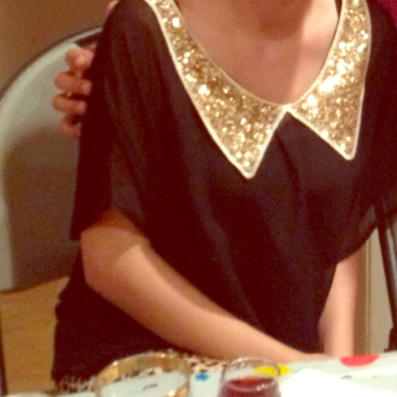 Black loose top with gold sequined collar. ON HOLD