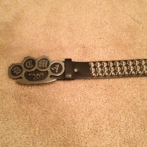 Studded belt with DCMA buckle.
