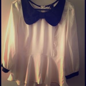 Cream and black peplum top