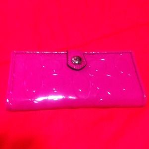 Coach embossed magenta wallet