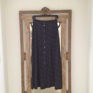 Long button down black polka dotted silk skirt.