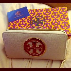 White leather Tory Burch zip wallet.