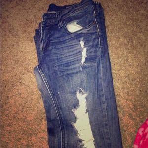 Dark blue ripped denim machine bell bottom jeans