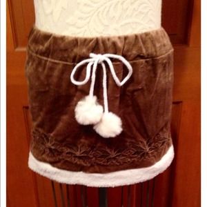 Warm up in this soft Sherpa trim skirt