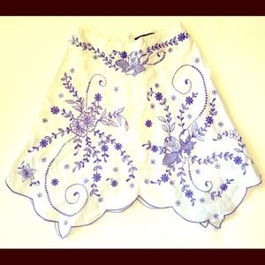 Embroidered linen skirt with eyelets