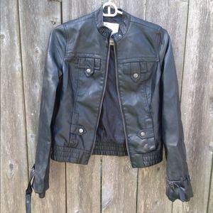 Faux leather jacket with belts on the arms