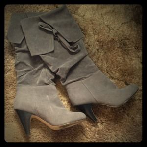 Grey boots. Pretty tall.