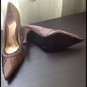 Quipid brown pointed toe heels.