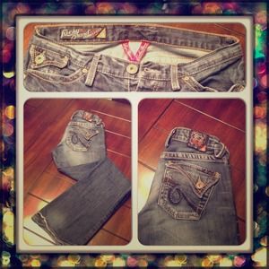 Lucky Brand jeans with button pockets.