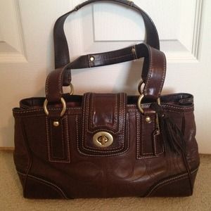 Brown leather signature logo Coach handbag.