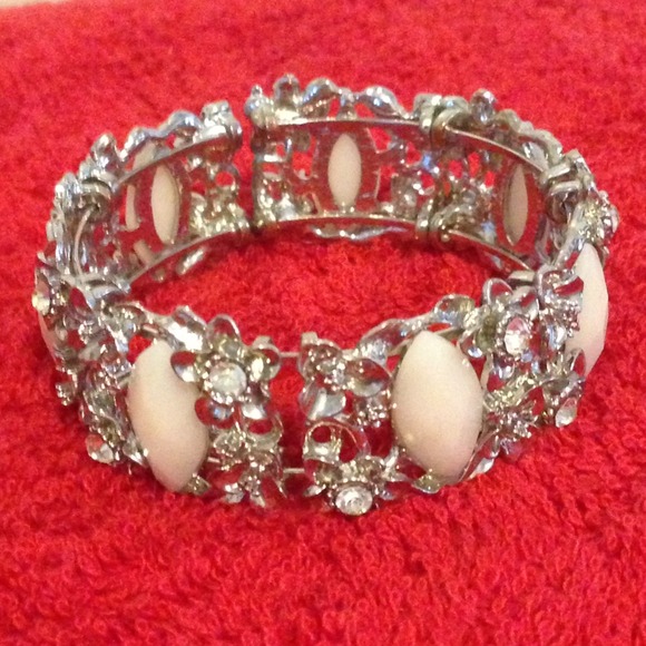 Silver colored bangle with floral detail - rare!