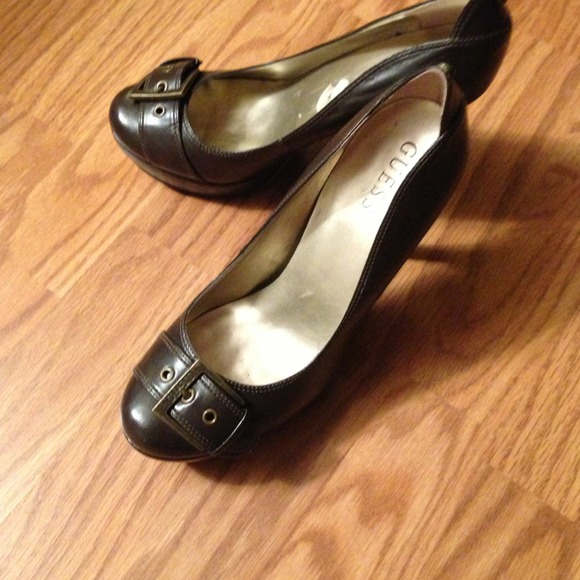 Pair of Guess dark brown high heels size 8 medium.
