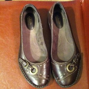 Clarks brown leather flats with gold buckle