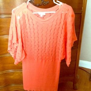 Salmon colored crocheted top.