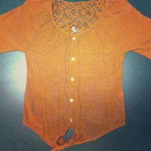 A burnt orange/ almost brown, shirt.