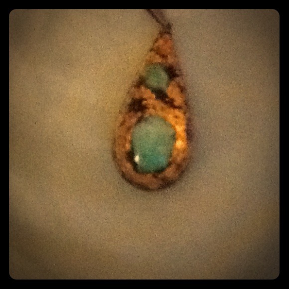 Gold pendant with teal accent