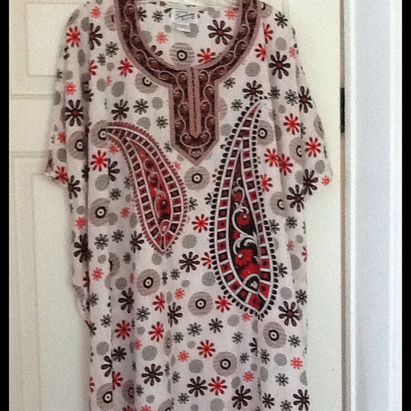 PONCHO STYLE TOP, CLOSED ON THE SIDES W/ARM HOLES