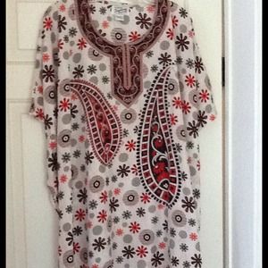 PONCHO STYLE TOP, CLOSED ON THE SIDES W/ARM HOLES