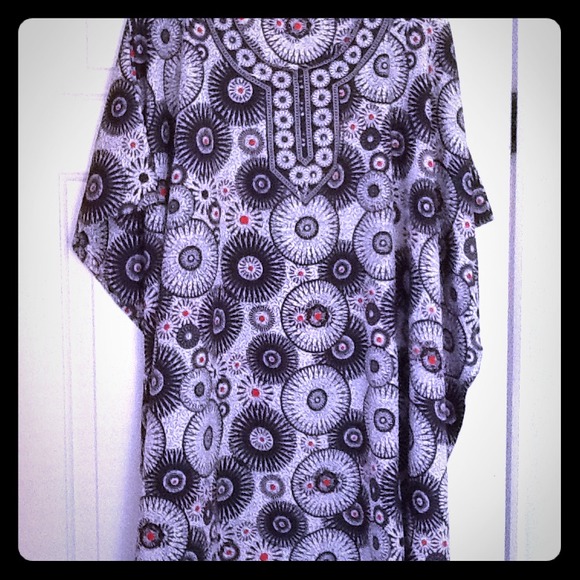 PONCHO STYLE TOP,CLOSED ON SIDES W/ARM HOLES