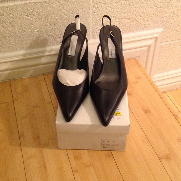 Black Sling Backs.
