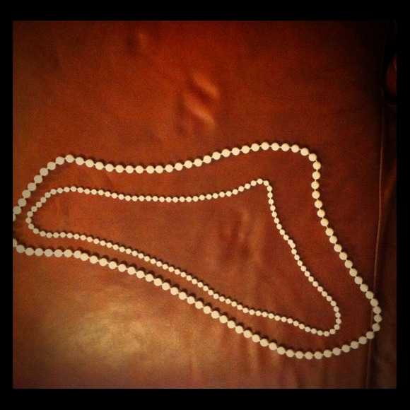 2 long strands of faux pearls