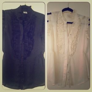 2 beautiful sheer , ruffled button down blouses .