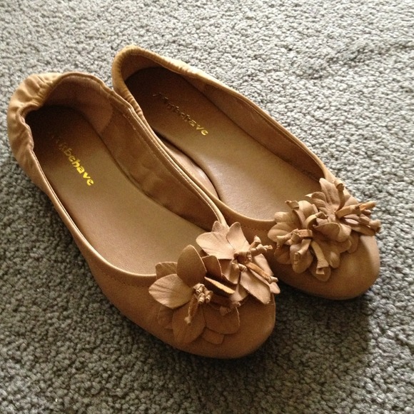 Tan ballet flats with floral accents