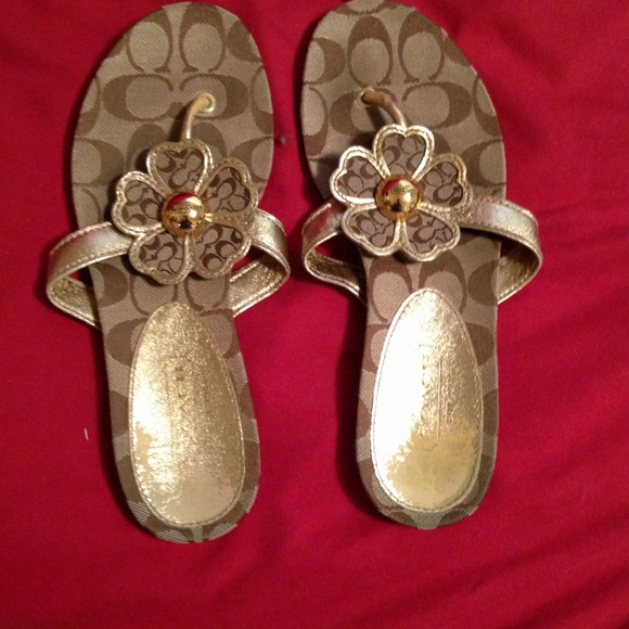 Gold coach flip flops