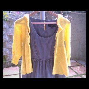 Adorable striped dress with yellow sweater.