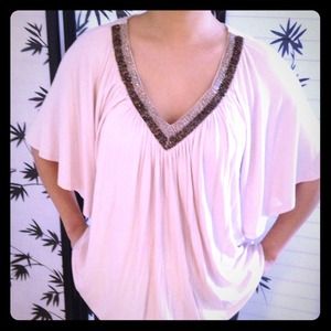 Dusty pink top with beading around the neck