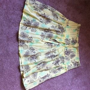 Light yellow skirt w brown and lime green flowers